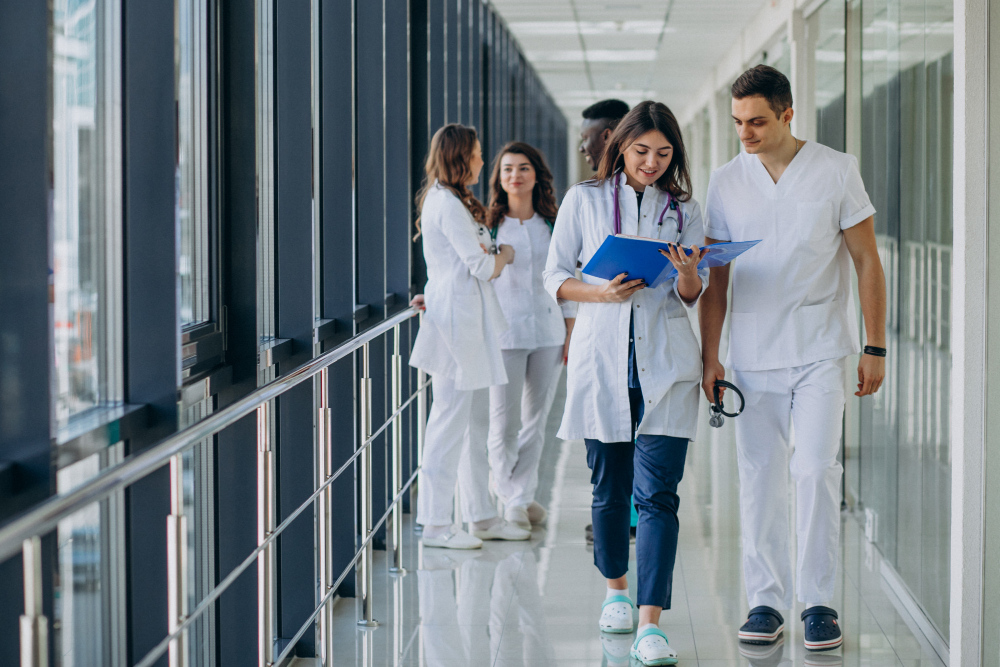 team young specialist doctors standing corridor hospital