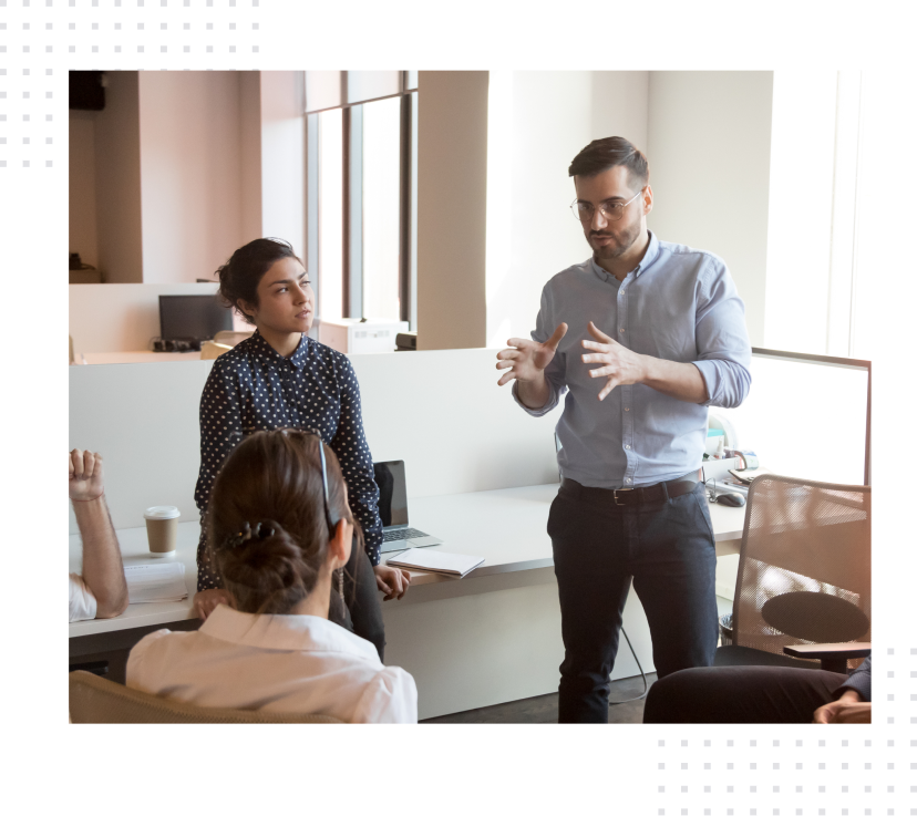 Development team discusses the project at a meeting