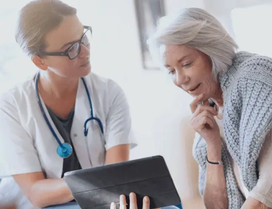 Doctor and patient looking at the tablet